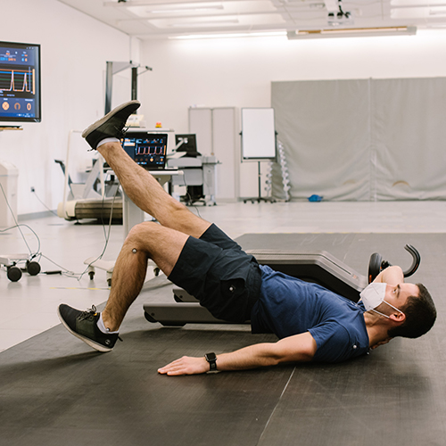 A Human Performance Centre participant performing exercises, linked to a computer readout
